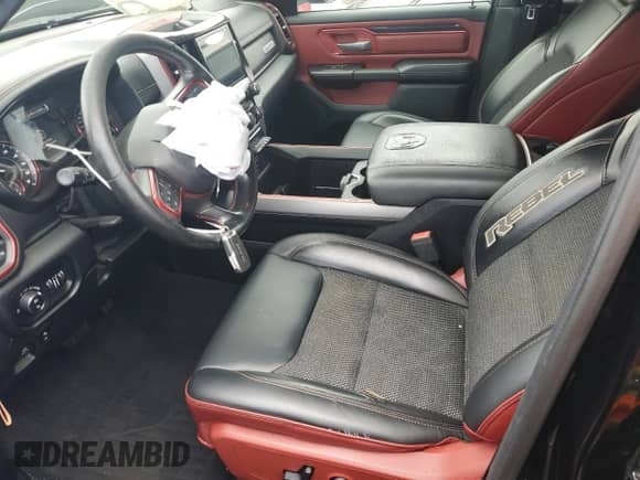 2019 Ram 1500 Rebel with VIN 1C6SRFLT0KN698856, listed as a Copart auction lot 69225485 with 143,146 mi miles and Salvage title. Bid and sale history available at DreamBid. Image 7.