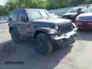 2024 Jeep Wrangler Sport S z VIN 1C4PJXAN9RW117133, wystawiony jako IAAI lot #42497915 z przebiegiem 9 754 mil mil oraz . Historia ofert i sprzedaży dostępna na DreamBid. Obrazek 1.