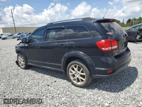 2014 Dodge Journey SXT with VIN 3C4PDCBB8ET304223, listed as a Copart auction lot 67085535 with 128,586 mi miles and Salvage title. Bid and sale history available at DreamBid. Image 2.