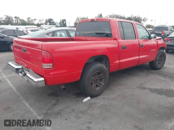 2001 Dodge Dakota Sport with VIN 1B7GL2AN31S106721, listed as a IAAI auction lot 43028369 with 238,641 mi miles and . Bid and sale history available at DreamBid. Image 4.