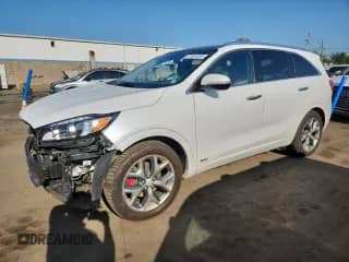 2017 Kia Sorento SXL z VIN 5XYPKDA52HG220126, wystawiony jako Copart lot #67591305 z przebiegiem 91 570 mil mil oraz Szkoda całkowita • Salvage title. Historia ofert i sprzedaży dostępna na DreamBid. Obrazek 1.