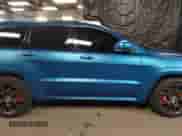 2014 Jeep Grand Cherokee SRT-8 z VIN 1C4RJFDJ0EC497826, wystawiony jako IAAI lot #38543666 z przebiegiem 79 937 mil mil oraz . Historia ofert i sprzedaży dostępna na DreamBid. Obrazek 13.