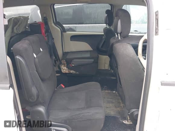 2013 Dodge Grand Caravan American Value with VIN 2C4RDGBG8DR723671, listed as a IAAI auction lot 43257680 with 166,197 mi miles and . Bid and sale history available at DreamBid. Image 8.