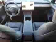 2024 Tesla Model Y с VIN 7SAYGDED1RF198302, выставлен на аукционе Copart как лот 83856115 с пробегом 12 875 миль миль и Списание • Salvage title. История ставок и продаж доступна на DreamBid. Изображение 8.