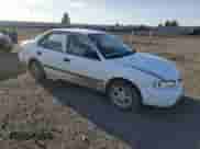 1998 Chevrolet Prizm with VIN 1Y1SK5284WZ433758, listed as a Copart auction lot 49698725 with 123,154 mi miles and Salvage title. Bid and sale history available at DreamBid. Image 4.