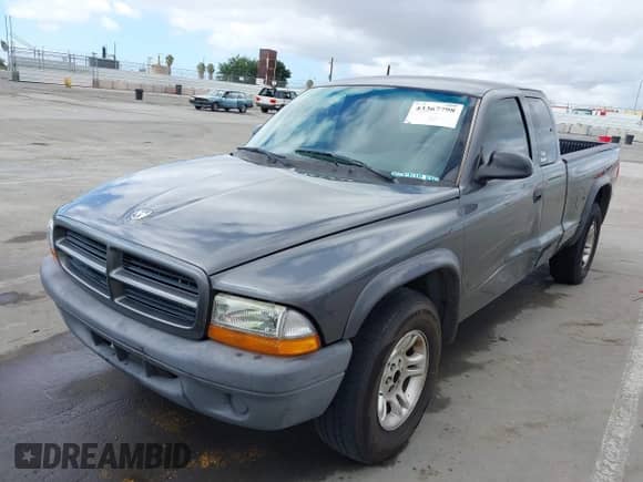 2003 Dodge Dakota with VIN 1D7HL12X73S232832, listed as a IAAI auction lot 43367798 with 213,084 mi miles and . Bid and sale history available at DreamBid. Image 2.