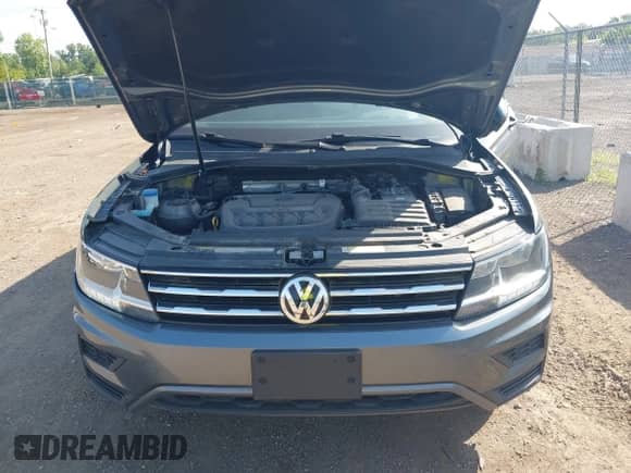 2021 Volkswagen Tiguan S z VIN 3VV0B7AX3MM038342, wystawiony jako IAAI lot #42545665 z przebiegiem 66 809 mil mil oraz . Historia ofert i sprzedaży dostępna na DreamBid. Obrazek 10.