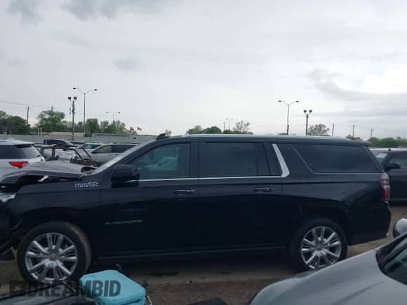 2023 Chevrolet Suburban High Country z VIN 1GNSKGKL5PR148645, wystawiony jako IAAI lot #41893981 z przebiegiem 64 928 mil mil oraz . Historia ofert i sprzedaży dostępna na DreamBid. Obrazek 14.