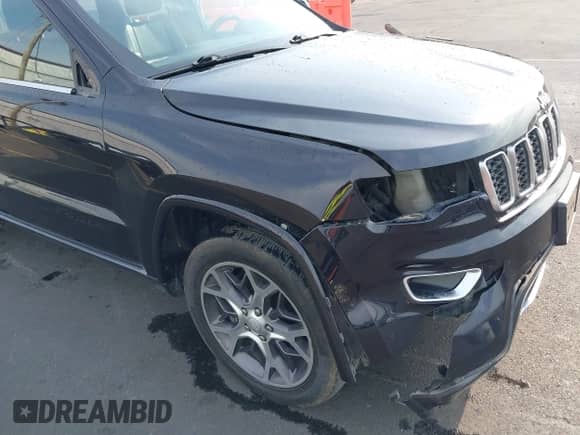 2018 Jeep Grand Cherokee Sterling with VIN 1C4RJFBT8JC326885, listed as a IAAI auction lot 43028769 with 124,755 mi miles and . Bid and sale history available at DreamBid. Image 19.