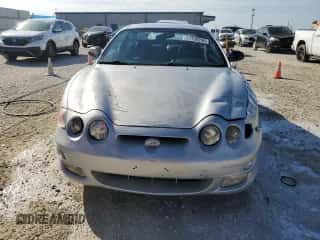 2001 Hyundai Tiburon с VIN KMHJG35F81U246024, выставлен на аукционе Copart как лот 77709294 с пробегом 127 057 миль миль и На запчасти • Non repairable. История ставок и продаж доступна на DreamBid. Изображение 5.