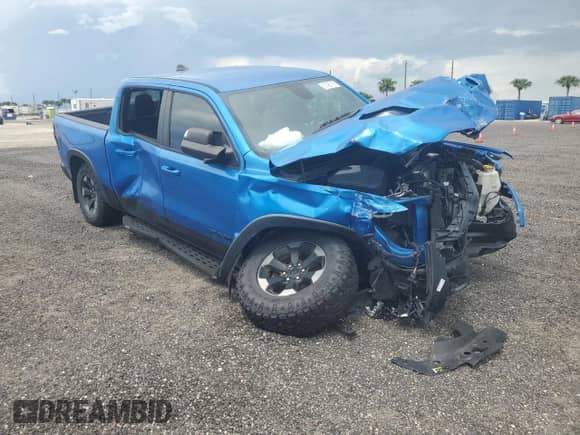 2020 Ram 1500 Rebel z VIN 1C6SRFLT4LN317415, wystawiony jako Copart lot #67455185 z przebiegiem 58 773 mil mil oraz Nie do naprawy • Non repairable. Historia ofert i sprzedaży dostępna na DreamBid. Obrazek 4.