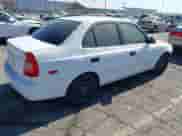 2002 Hyundai Accent GL z VIN KMHCG45C42U375352, wystawiony jako IAAI lot #42699297 z przebiegiem 103 540 mil mil oraz . Historia ofert i sprzedaży dostępna na DreamBid. Obrazek 4.