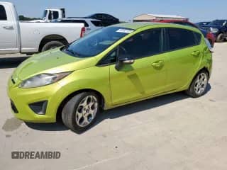 2012 Ford Fiesta SES with VIN 3FADP4FJ3CM111721, listed as a Copart auction lot 80182725 with 119,654 mi miles and Salvage title. Bid and sale history available at DreamBid. Image 1.