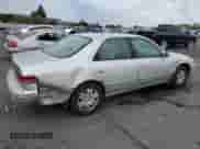 2001 Toyota Camry LE z VIN 4T1BF22KX1U117835, wystawiony jako Copart lot #85137565 z przebiegiem 164 532 mil mil oraz Szkoda całkowita • Salvage title. Historia ofert i sprzedaży dostępna na DreamBid. Obrazek 3.