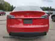 2021 Tesla Model Y Long Range with VIN 5YJYGAEE2MF215721, listed as a Copart auction lot 84570055 with 42,763 mi miles and Salvage title. Bid and sale history available at DreamBid. Image 6.