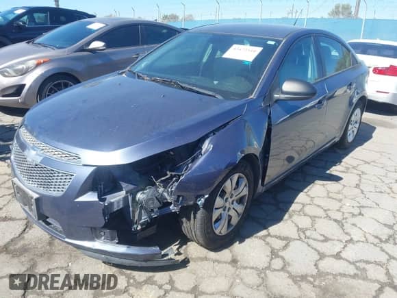 2014 Chevrolet Cruze LS with VIN 1G1PA5SG2E7180012, listed as a IAAI auction lot 43472510 with 104,029 mi miles and . Bid and sale history available at DreamBid. Image 2.