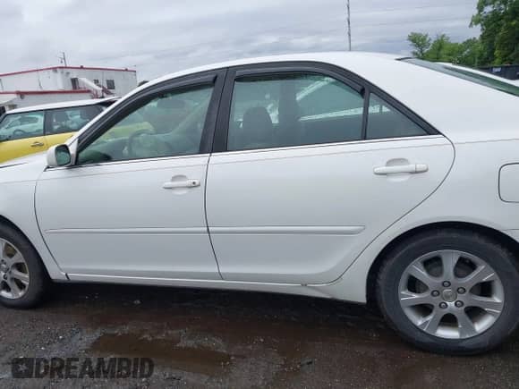 2004 Toyota Camry LE with VIN JTDBE32K740273954, listed as a IAAI auction lot 42323760 with 250,815 mi miles and . Bid and sale history available at DreamBid. Image 14.