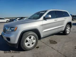 2012 Jeep Grand Cherokee Laredo z VIN 1C4RJEAG4CC334306, wystawiony jako Copart lot #84922785 z przebiegiem 185 339 mil mil oraz Szkoda całkowita • Salvage title. Historia ofert i sprzedaży dostępna na DreamBid. Obrazek 1.