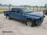 2002 Dodge Dakota Sport with VIN 1B7HL38N32S612860, listed as a Copart auction lot 70562135 with 227,963 mi miles and Non repairable. Bid and sale history available at DreamBid. Image 4.