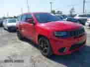 2018 Jeep Grand Cherokee Trackhawk z VIN 1C4RJFN95JC309851, wystawiony jako IAAI lot #42437320 z przebiegiem 56 504 mil mil oraz . Historia ofert i sprzedaży dostępna na DreamBid. Obrazek 1.