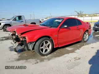 2003 Ford Mustang GT Deluxe с VIN 1FAFP42X83F370420, выставлен на аукционе Copart как лот 84796865 с пробегом 247 894 миль миль и Списание • Salvage title. История ставок и продаж доступна на DreamBid. Изображение 1.