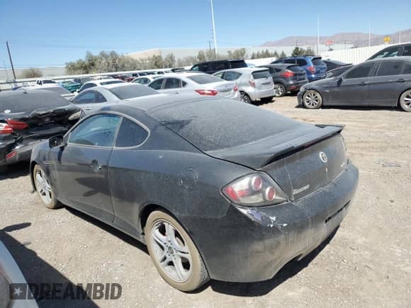 2007 Hyundai Tiburon GS z VIN KMHHM66D27U236507, wystawiony jako Copart lot #41334155 z przebiegiem 97 162 mil mil oraz Szkoda całkowita • Salvage title. Historia ofert i sprzedaży dostępna na DreamBid. Obrazek 2.