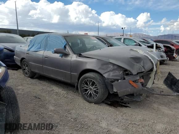 1994 Toyota Camry LE z VIN JT2SK12E0R0215689, wystawiony jako Copart lot #68546935 z przebiegiem 334 264 mil mil oraz Nie do naprawy • Non repairable. Historia ofert i sprzedaży dostępna na DreamBid. Obrazek 4.