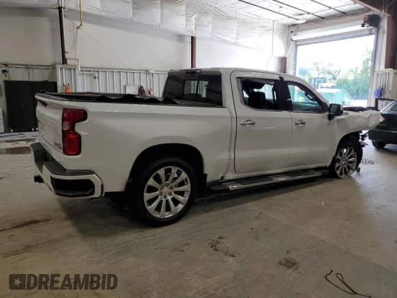 2021 Chevrolet Silverado 1500 High Country with VIN 1GCUYHEL7MZ255063, listed as a Copart auction lot 64203335 with 103,889 mi miles and Salvage title. Bid and sale history available at DreamBid. Image 3.