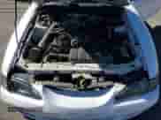1998 Ford Mustang GT z VIN 1FAFP42X9WF179805, wystawiony jako Copart lot #82494395 z przebiegiem 142 724 mil mil oraz Szkoda całkowita • Salvage title. Historia ofert i sprzedaży dostępna na DreamBid. Obrazek 11.