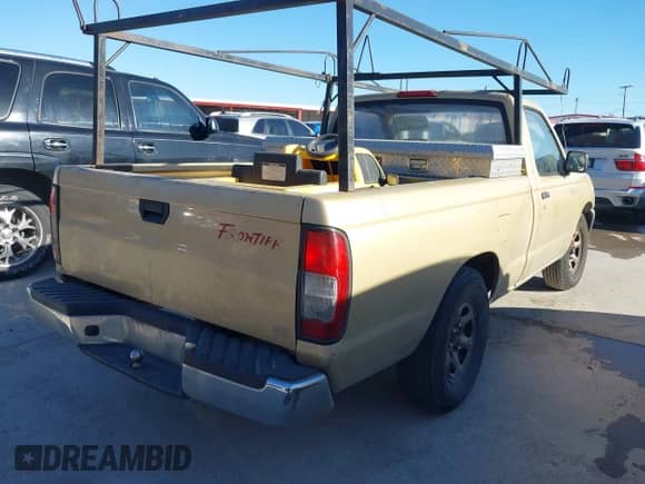 1998 Nissan Frontier XE with VIN 1N6DD21S6WC370973, listed as a IAAI auction lot 41404423 with Not provided miles and . Bid and sale history available at DreamBid. Image 4.