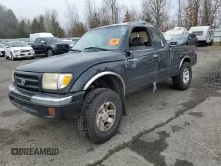 1998 Toyota Tacoma with VIN 4TASM92N7WZ150570, listed as a Copart auction lot 52707425 with 301,953 mi miles and Salvage title. Bid and sale history available at DreamBid. Image 1.