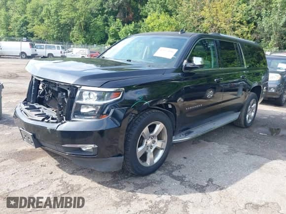 2015 Chevrolet Suburban LTZ z VIN 1GNSCKKC7FR268252, wystawiony jako IAAI lot #42977046 z przebiegiem 110 363 mil mil oraz . Historia ofert i sprzedaży dostępna na DreamBid. Obrazek 2.