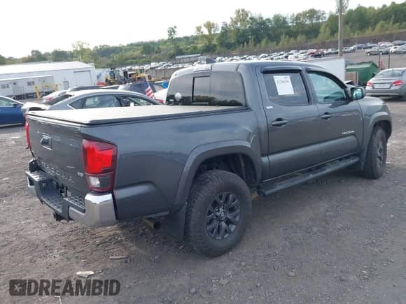 2021 Toyota Tacoma SR with VIN 3TMCZ5AN7MM383352, listed as a IAAI auction lot 43246296 with 44,937 mi miles and . Bid and sale history available at DreamBid. Image 4.