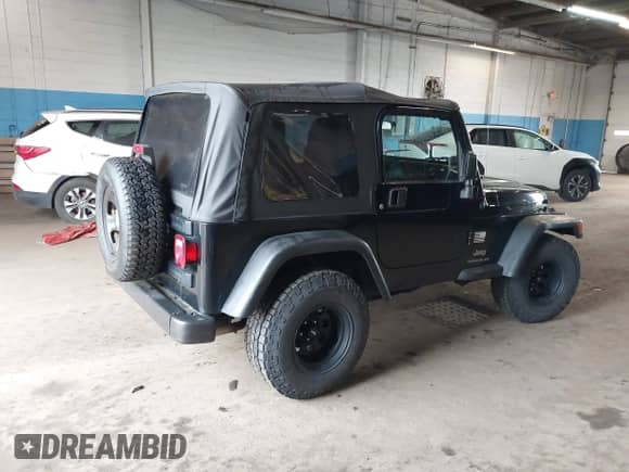 2005 Jeep Wrangler SE z VIN 1J4FA29195P358723, wystawiony jako IAAI lot #42158664 z przebiegiem 126 849 mil mil oraz . Historia ofert i sprzedaży dostępna na DreamBid. Obrazek 4.