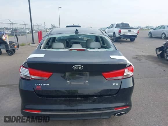 2016 Kia Optima EX with VIN 5XXGU4L36GG070739, listed as a IAAI auction lot 42765882 with 64,815 mi miles and . Bid and sale history available at DreamBid. Image 16.