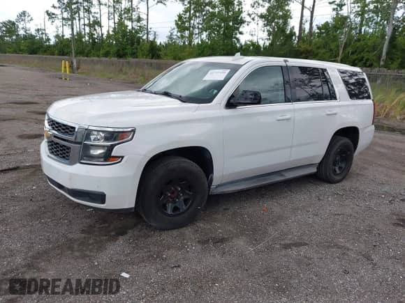 2015 Chevrolet Tahoe Commercial with VIN 1GNLC2ECXFR559652, listed as a IAAI auction lot 42727539 with 112,026 mi miles and . Bid and sale history available at DreamBid. Image 2.