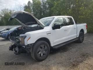 2023 Ford F-150 Lightning Pro with VIN 1FT6W1EV4PWG24555, listed as a Copart auction lot 66712485 with 38,460 mi miles and Salvage title. Bid and sale history available at DreamBid. Image 1.