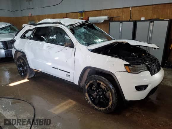 2021 Jeep Grand Cherokee Freedom with VIN 1C4RJFAG1MC801351, listed as a Copart auction lot 57141605 with 61,567 mi miles and Non repairable. Bid and sale history available at DreamBid. Image 4.