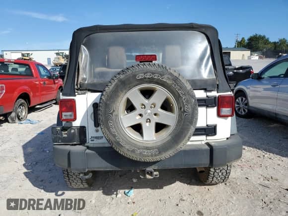 2012 Jeep Wrangler Sport with VIN 1C4AJWAG5CL220348, listed as a Copart auction lot 69854545 with 124,454 mi miles and Salvage title. Bid and sale history available at DreamBid. Image 6.
