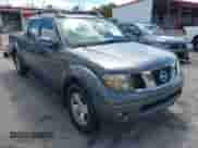 2007 Nissan Frontier SE with VIN 1N6AD09U57C406389, listed as a IAAI auction lot 43268541 with 214,542 mi miles and . Bid and sale history available at DreamBid. Image 1.
