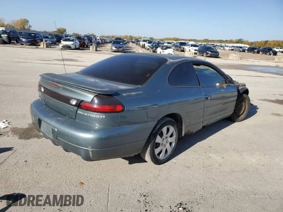1999 Dodge Avenger with VIN 4B3AU42NXXE127845, listed as a Copart auction lot 77039954 with 113,630 mi miles and Salvage title. Bid and sale history available at DreamBid. Image 3.