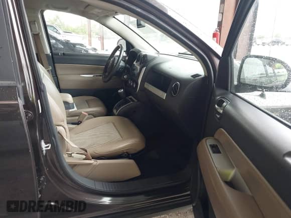 2014 Jeep Compass Latitude with VIN 1C4NJCEB5ED691041, listed as a IAAI auction lot 43112471 with 117,596 mi miles and . Bid and sale history available at DreamBid. Image 5.