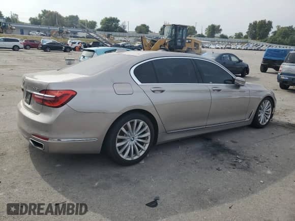 2017 BMW 7 Series 740i с VIN WBA7E2C3XHG741287, выставлен на аукционе Copart как лот 81467345 с пробегом 112 218 миль миль и Списание • Salvage title. История ставок и продаж доступна на DreamBid. Изображение 3.