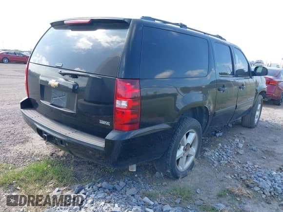2007 Chevrolet Suburban LT z VIN 1GNFC16097J350432, wystawiony jako IAAI lot #42789067 z przebiegiem 316 142 mil mil oraz . Historia ofert i sprzedaży dostępna na DreamBid. Obrazek 4.