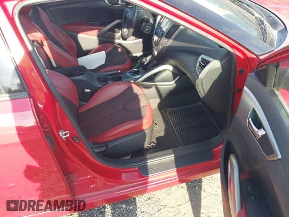 2012 Hyundai Veloster w/Gray Int z VIN KMHTC6AD2CU054210, wystawiony jako IAAI lot #43092914 z przebiegiem 98 899 mil mil oraz . Historia ofert i sprzedaży dostępna na DreamBid. Obrazek 5.