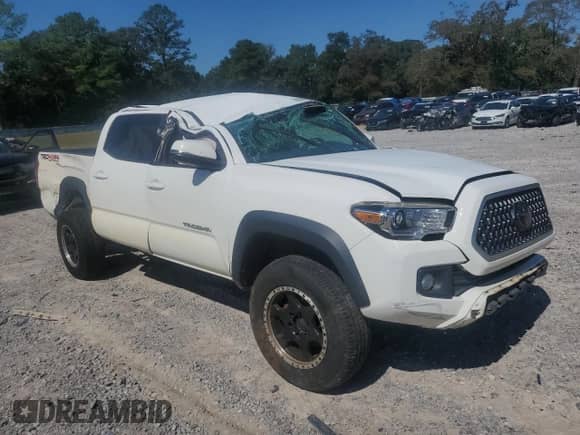 2019 Toyota Tacoma TRD Off Road z VIN 3TMCZ5AN9KM282522, wystawiony jako Copart lot #85939905 z przebiegiem 89 447 mil mil oraz Nie do naprawy • Non repairable. Historia ofert i sprzedaży dostępna na DreamBid. Obrazek 4.