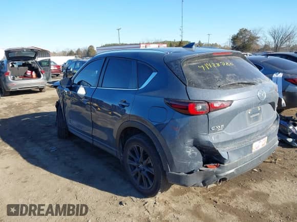 2022 Mazda CX-5 S Carbon Edition z VIN JM3KFBCM0N1561809, wystawiony jako IAAI lot #41428780 z przebiegiem 82 103 mil mil oraz . Historia ofert i sprzedaży dostępna na DreamBid. Obrazek 3.