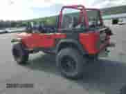 1995 Jeep Wrangler S with VIN 1J4FY19P3SP285709, listed as a Copart auction lot 69659545 with 200,636 mi miles and Salvage title. Bid and sale history available at DreamBid. Image 2.