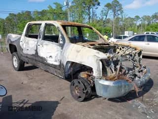 2018 Chevrolet Silverado 1500 LT z VIN 3GCUKREC0JG103144, wystawiony jako IAAI lot #42018027 z przebiegiem Nie podano mil oraz . Historia ofert i sprzedaży dostępna na DreamBid. Obrazek 1.