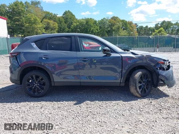 2025 Mazda CX-5 S Carbon Edition z VIN JM3KFBCM9S0704712, wystawiony jako IAAI lot #43104311 z przebiegiem 3 mil mil oraz . Historia ofert i sprzedaży dostępna na DreamBid. Obrazek 13.